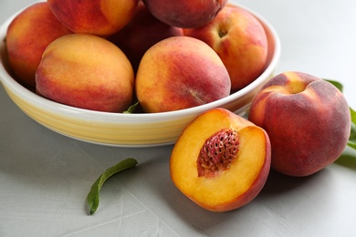 Photo of Fresh sweet peaches on light table, closeup
