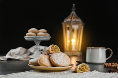 Photo of Traditional cookies for Islamic holidays on table. Eid Mubarak