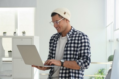 Freelancer working on laptop in home office