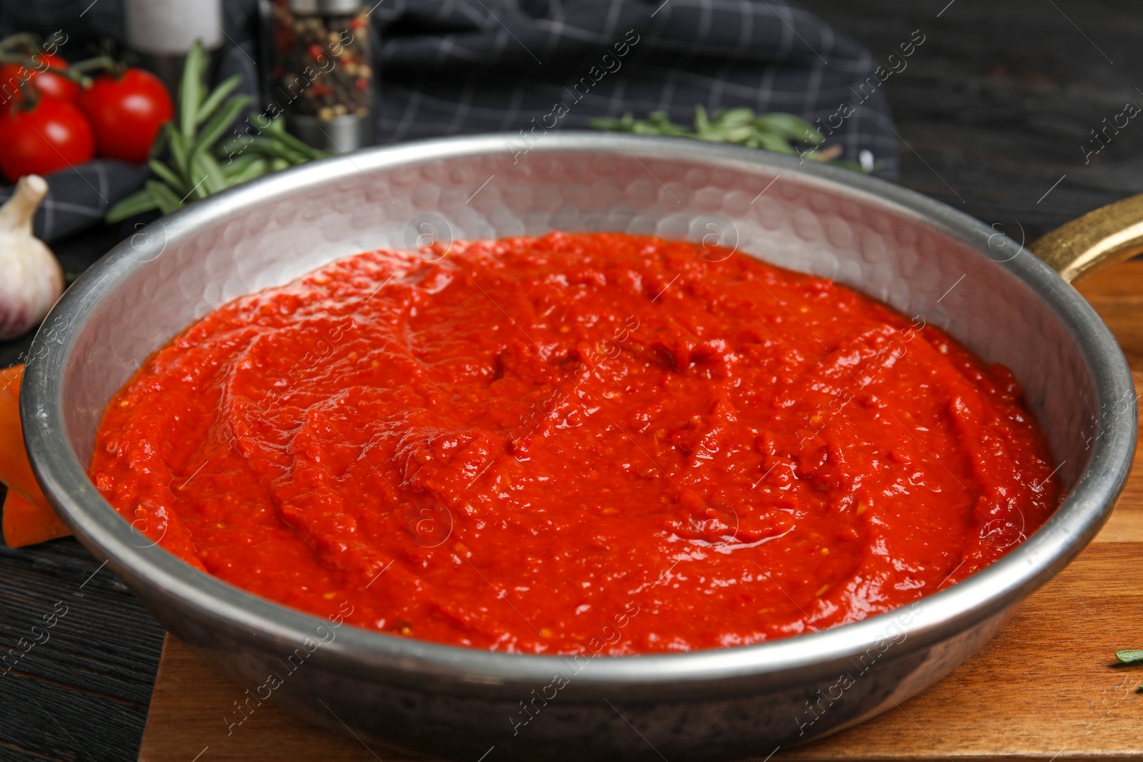 Photo of Delicious tomato sauce in pan, closeup view