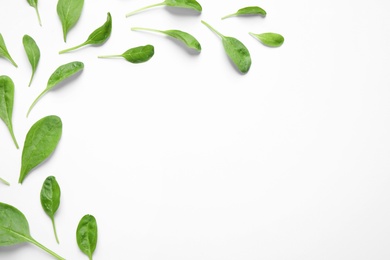 Photo of Fresh green healthy spinach on white background, top view