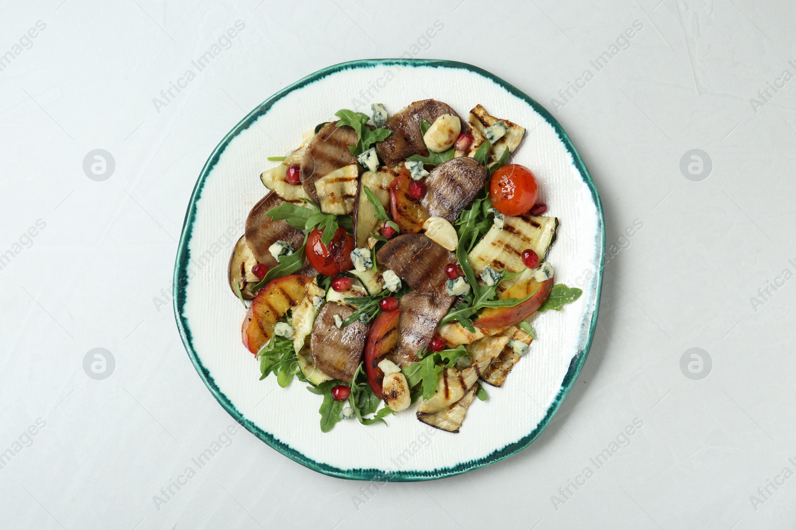 Photo of Delicious salad with beef tongue, grilled vegetables, peach and blue cheese on white table, top view