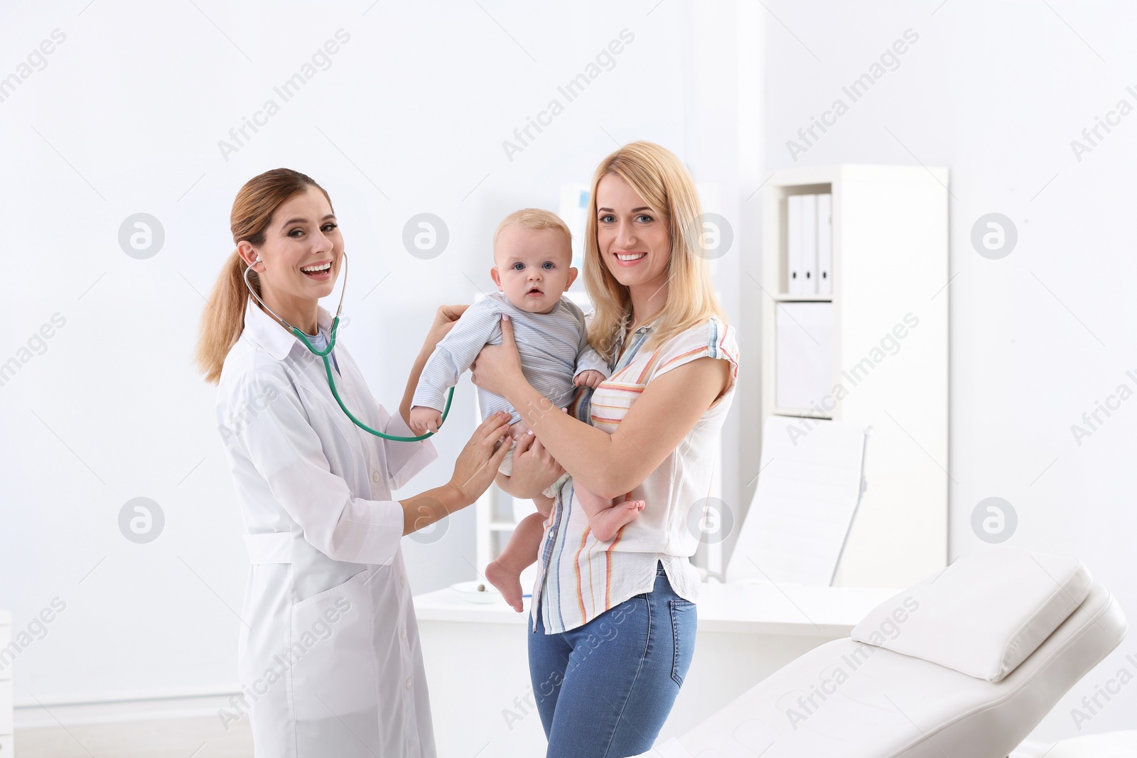 Photo of Woman with her baby visiting children's doctor in hospital