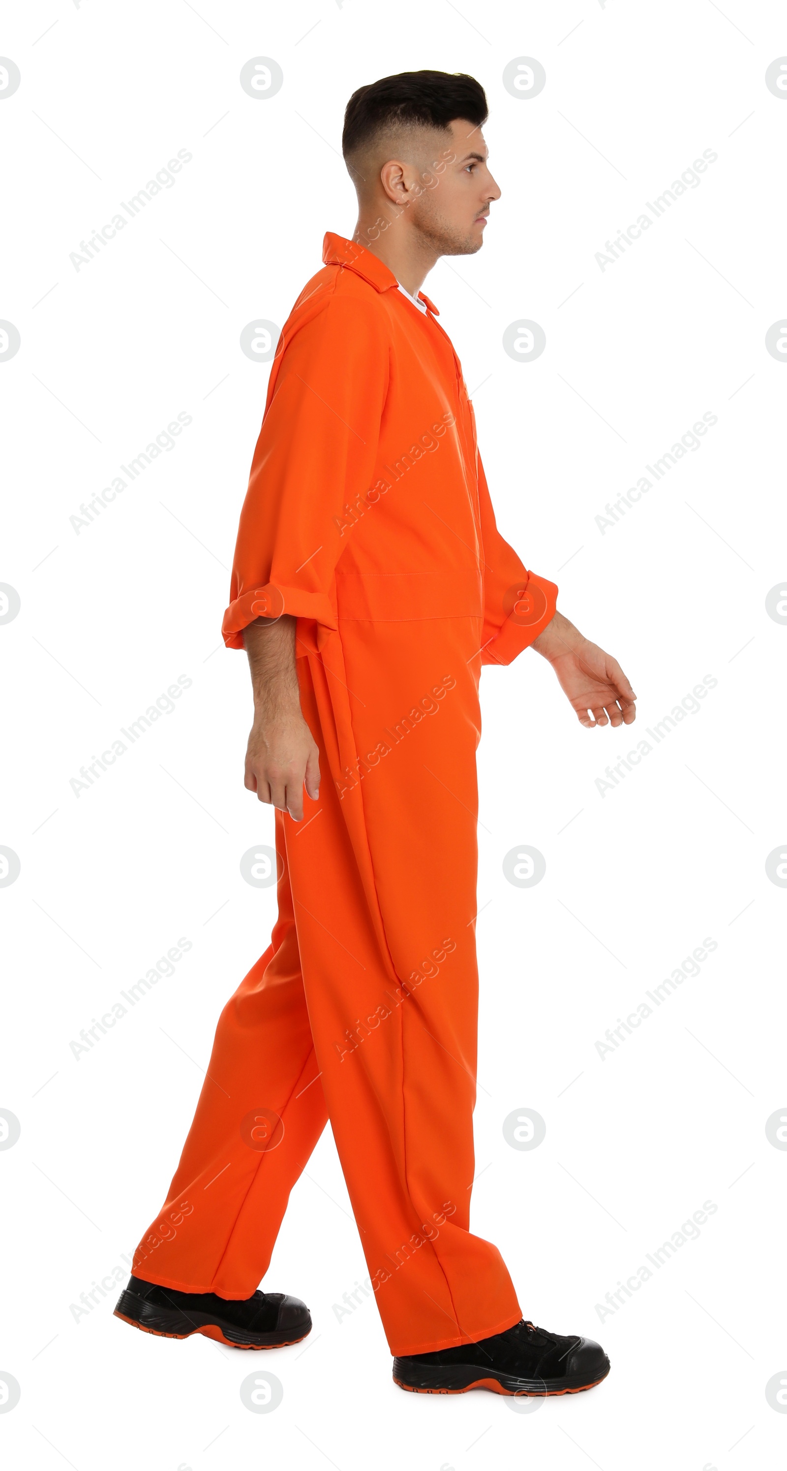 Photo of Prisoner in orange jumpsuit on white background