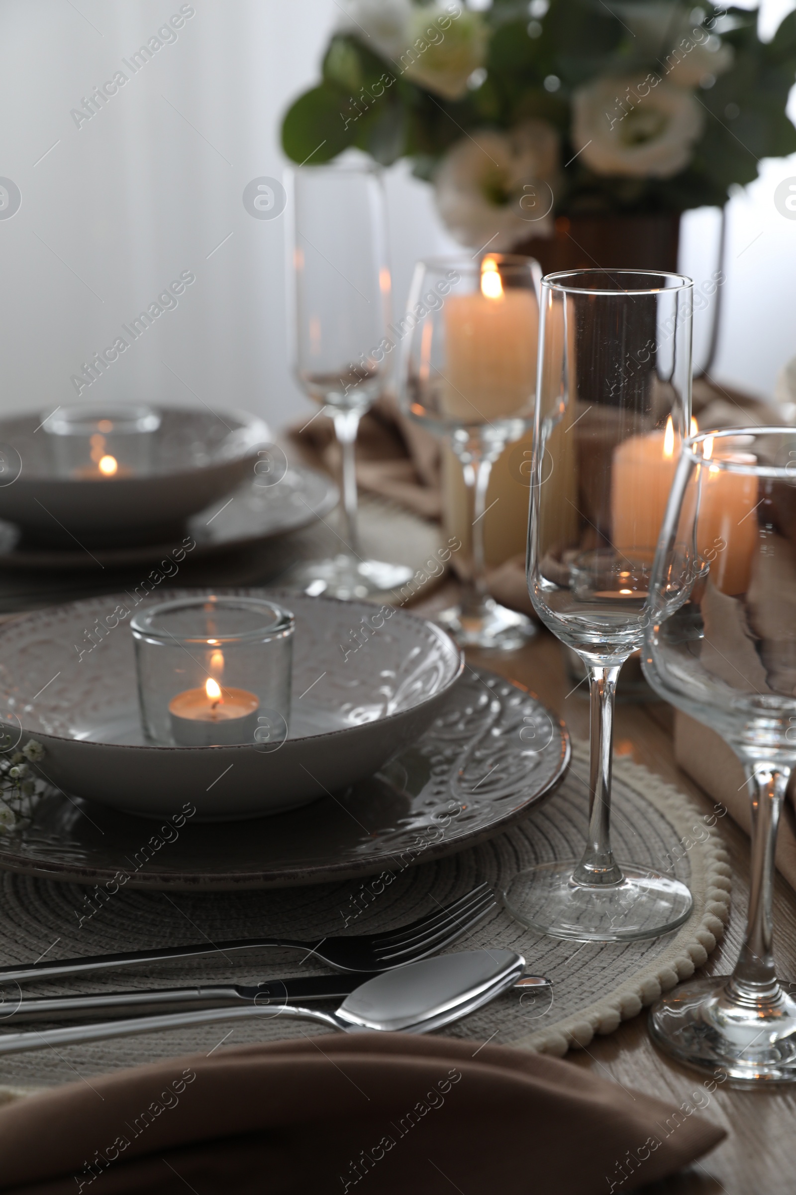 Photo of Festive table setting with beautiful floral decor in restaurant