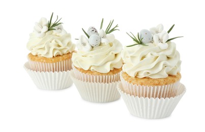 Photo of Tasty Easter cupcakes with vanilla cream isolated on white