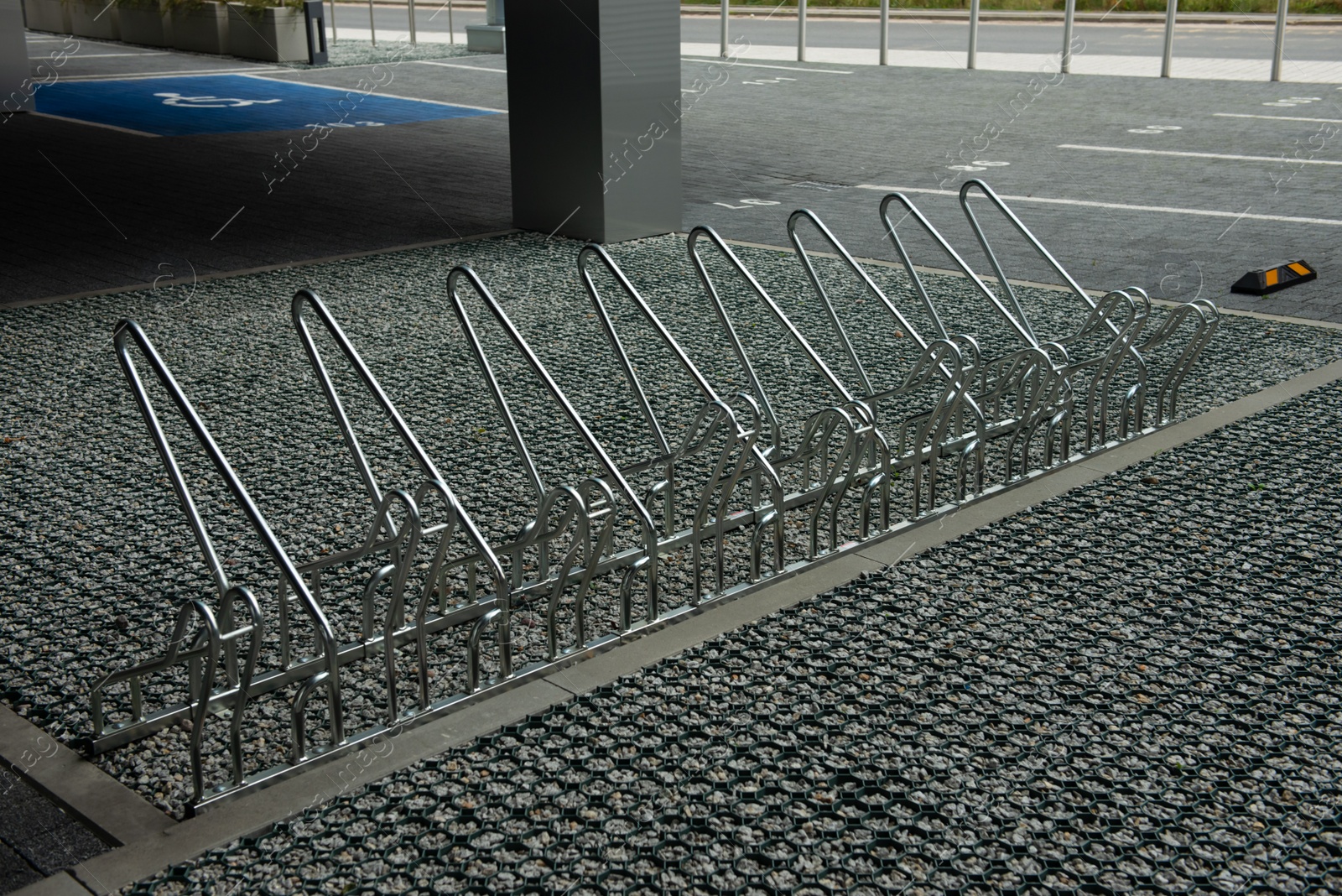 Photo of Empty metal parking rack for bicycles outdoors