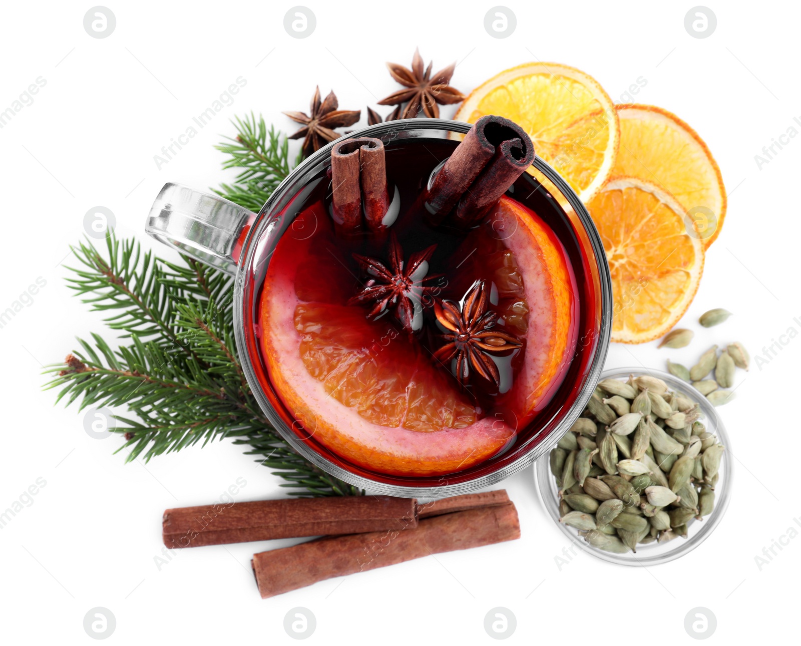 Photo of Aromatic mulled wine and ingredients on white background, top view