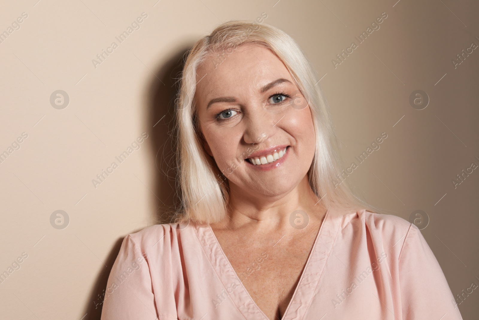 Photo of Portrait of mature woman on color background