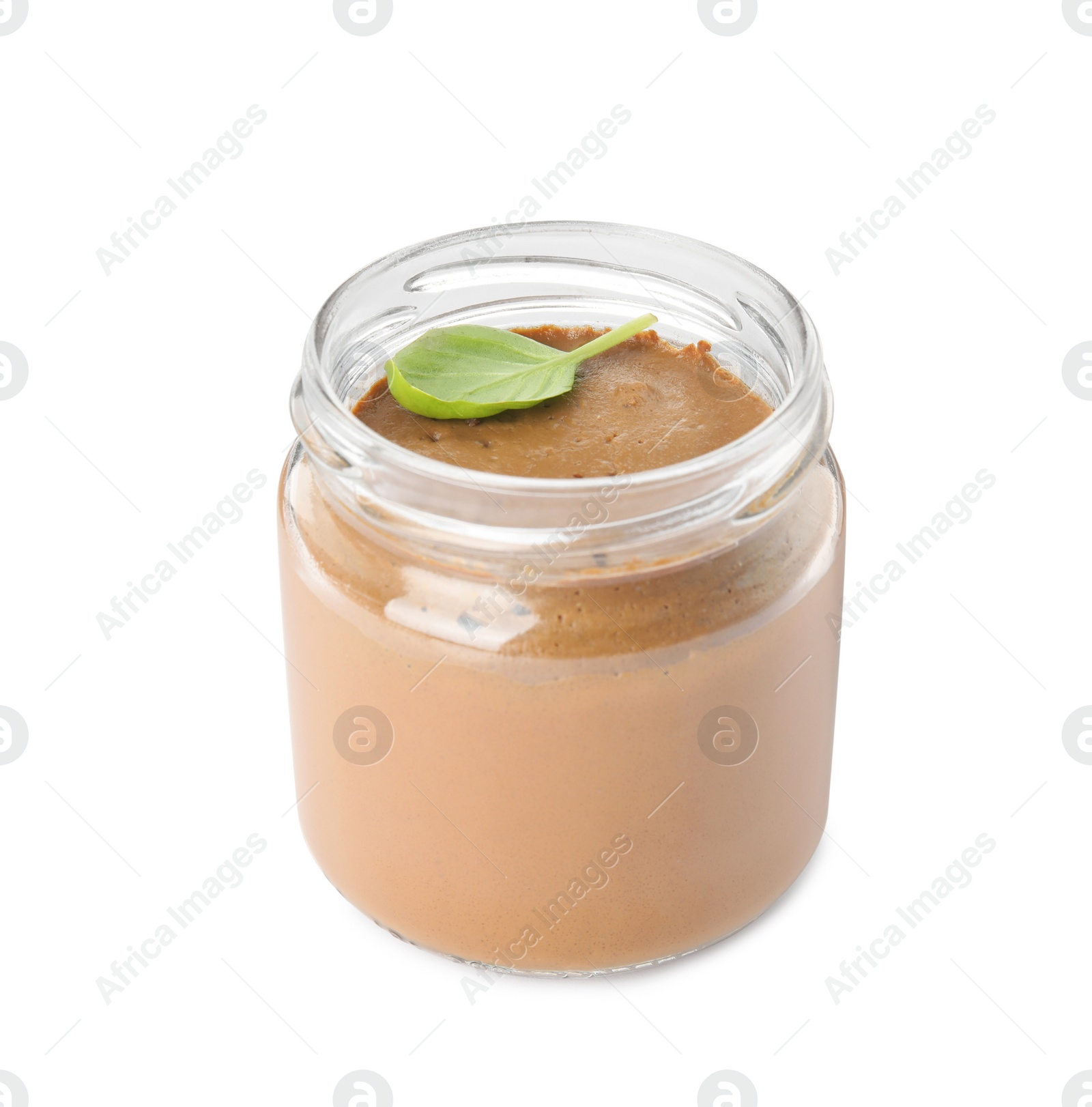 Photo of Delicious meat pate and basil leaf in glass jar isolated on white