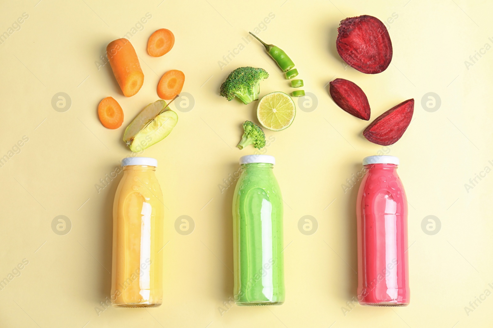 Photo of Flat lay composition with healthy detox smoothies and ingredients on light background