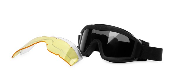 Photo of Tactical glasses and different lenses on white background. Military training equipment