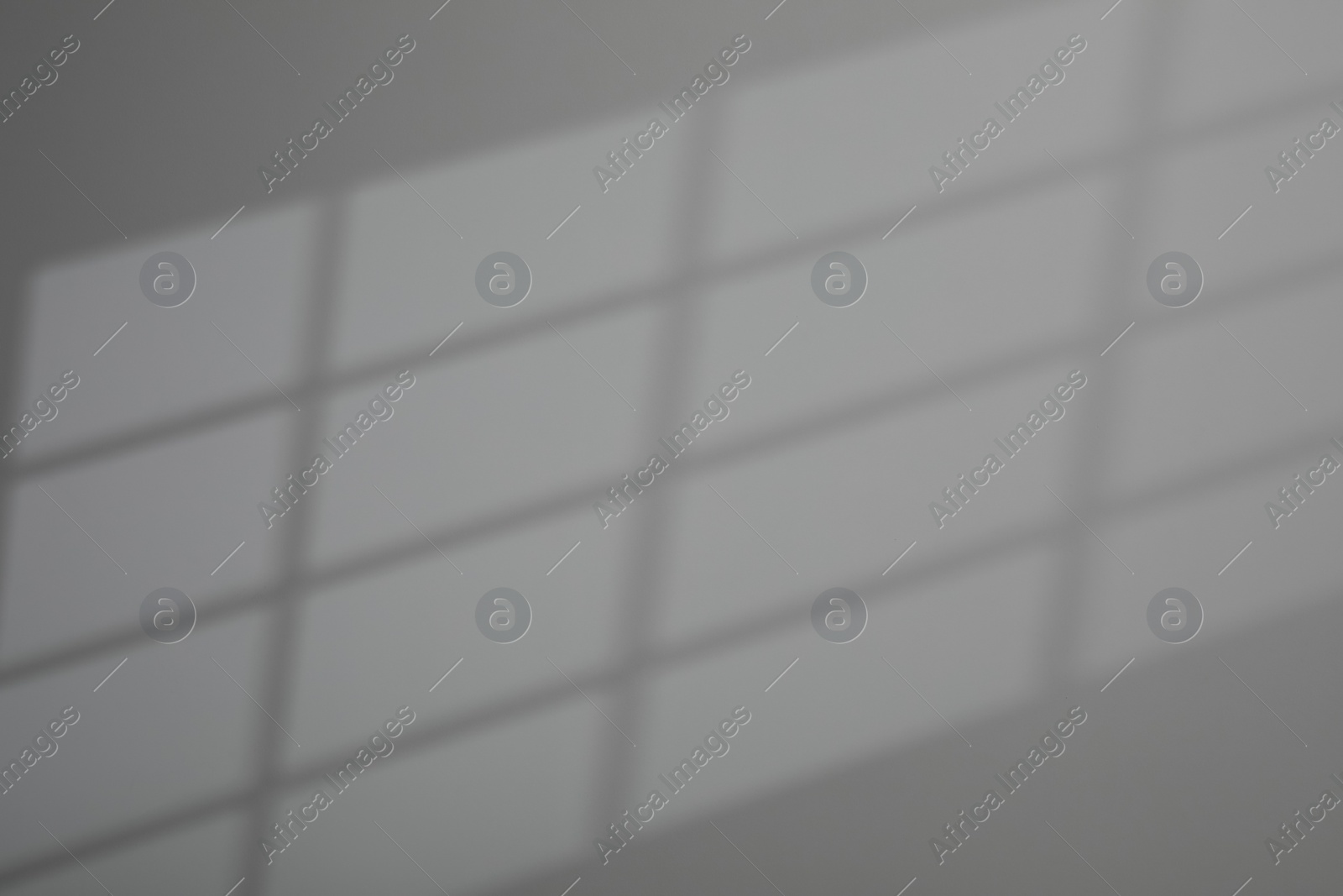 Photo of Shadow from window on grey wall indoors