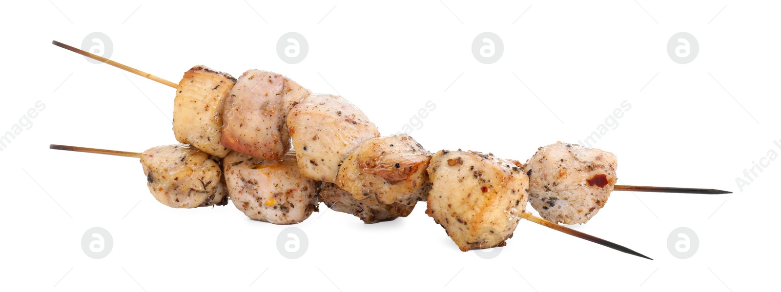 Photo of Skewers with delicious fresh shish kebabs isolated on white