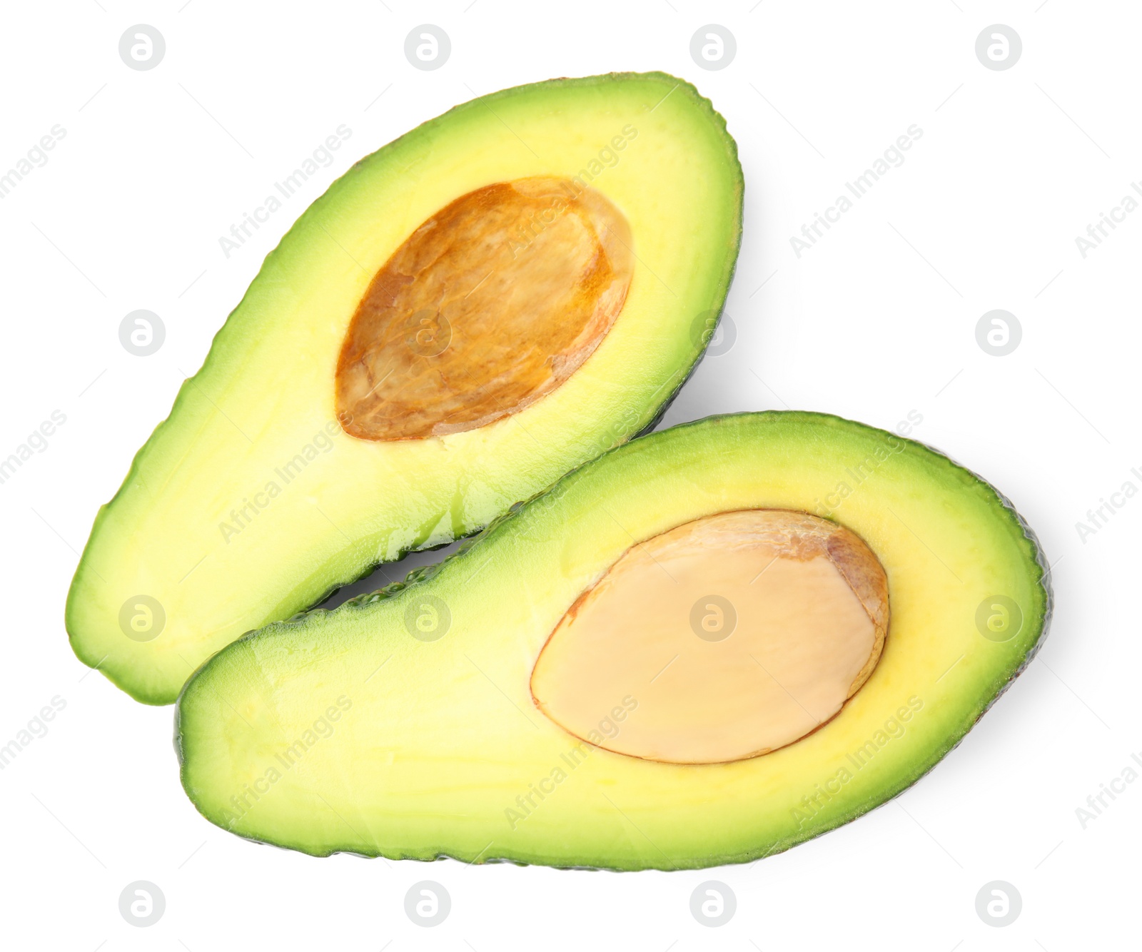 Photo of Cut tasty ripe avocados on white background, top view. Tropical fruit