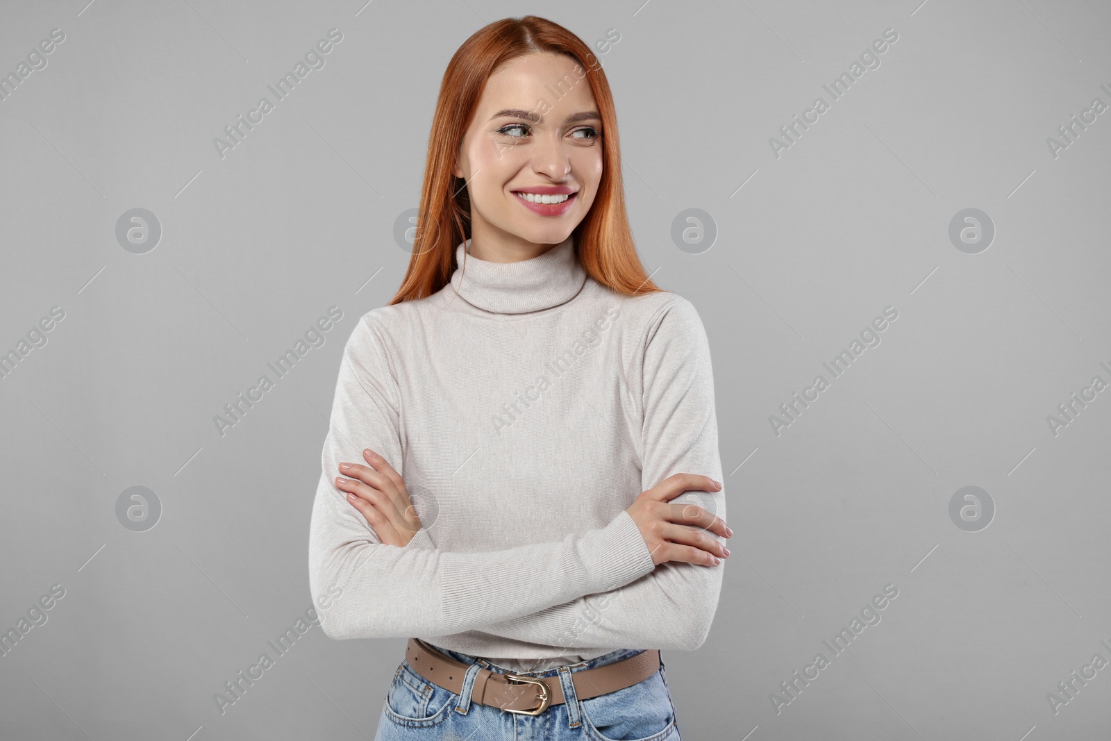 Photo of Portrait of beautiful young woman on light gray background