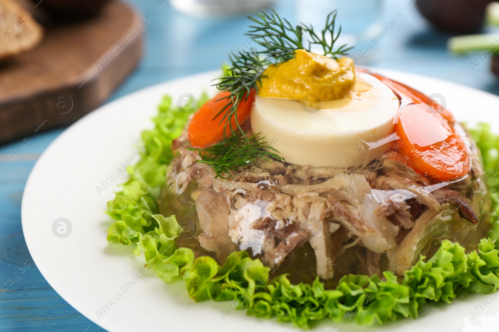 Photo of Delicious aspic with meat and vegetables on plate, closeup