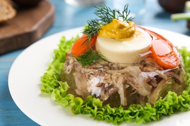 Photo of Delicious aspic with meat and vegetables on plate, closeup