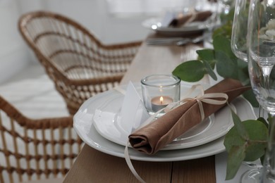 Festive table setting with beautiful tableware and decor indoors