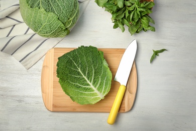Photo of Flat lay composition with savoy cabbage and basil on white wooden background