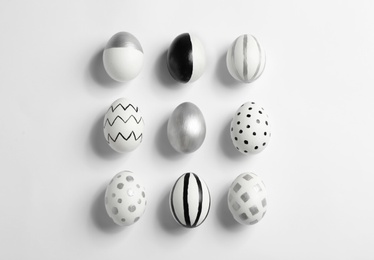 Photo of Painted Easter eggs on white background, top view
