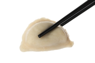 Photo of Chopsticks with boiled dumpling isolated on white