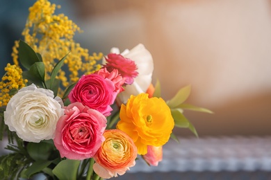 Photo of Beautiful ranunculus flowers on blurred background
