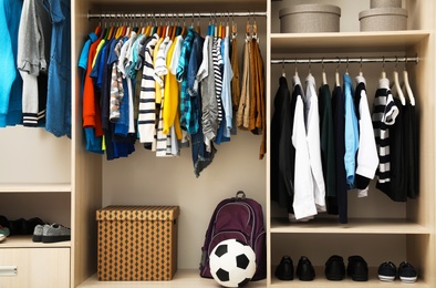 Photo of Large wardrobe with teenager clothes, shoes and accessories