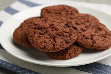 Photo of Delicious chocolate chip cookies on plate, closeup
