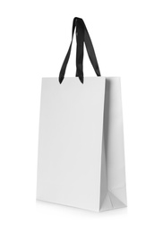 Photo of Paper shopping bag isolated on white. Mock up for design