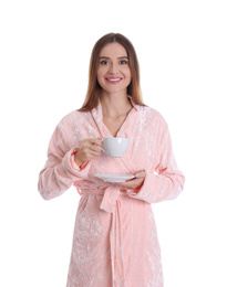 Photo of Young woman in bathrobe with cup of drink on white background