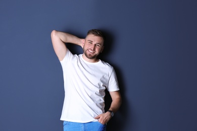 Photo of Portrait of handsome happy man on grey background, space for text