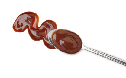 Photo of Tasty barbecue sauce and spoon isolated on white, top view