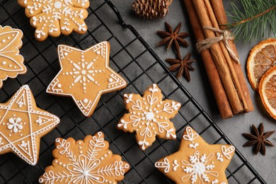 Photo of Tasty Christmas cookies and spices on grey table, flat lay