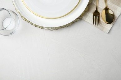 Photo of Beautiful table setting on grey background, flat lay. Space for text