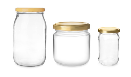 Image of Set with closed empty glass jars on white background