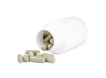 Vitamin capsules and medical bottle isolated on white