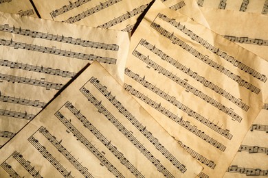 Photo of Many old note sheets as background, top view