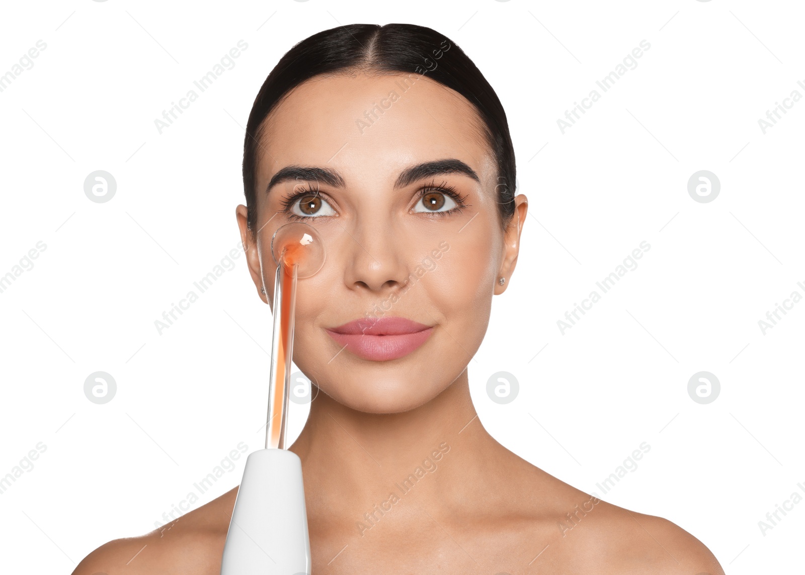 Photo of Woman using high frequency darsonval device on white background