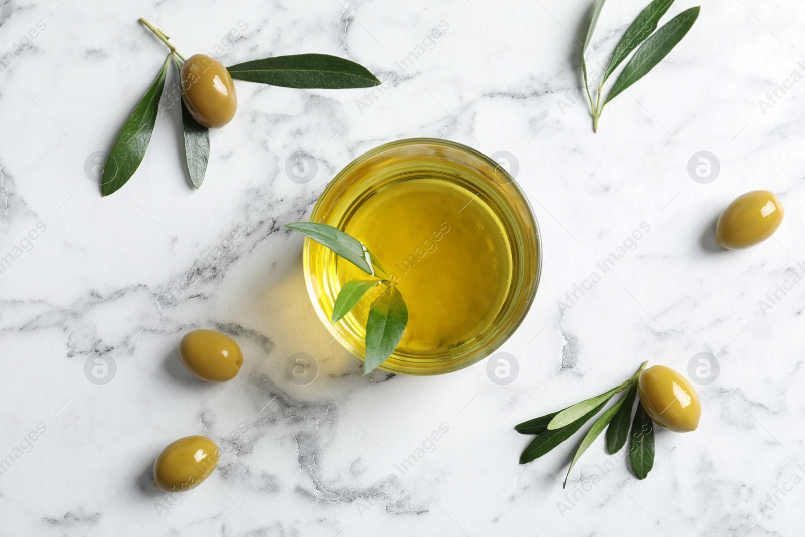 Photo of Flat lay composition with fresh olive oil on marble background