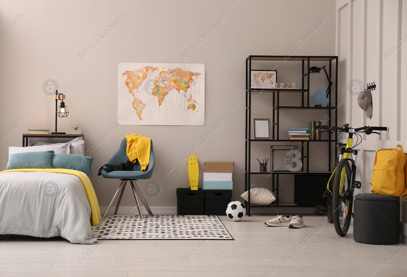 Photo of Stylish teenager's room interior with comfortable bed and sports equipment