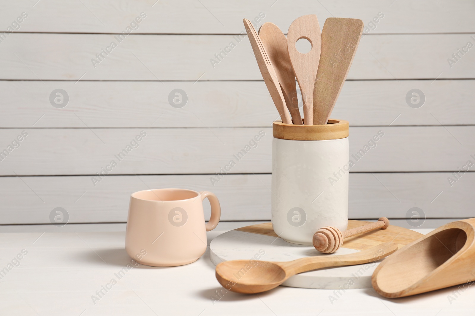 Photo of Set of different kitchen utensils on white table, space for text