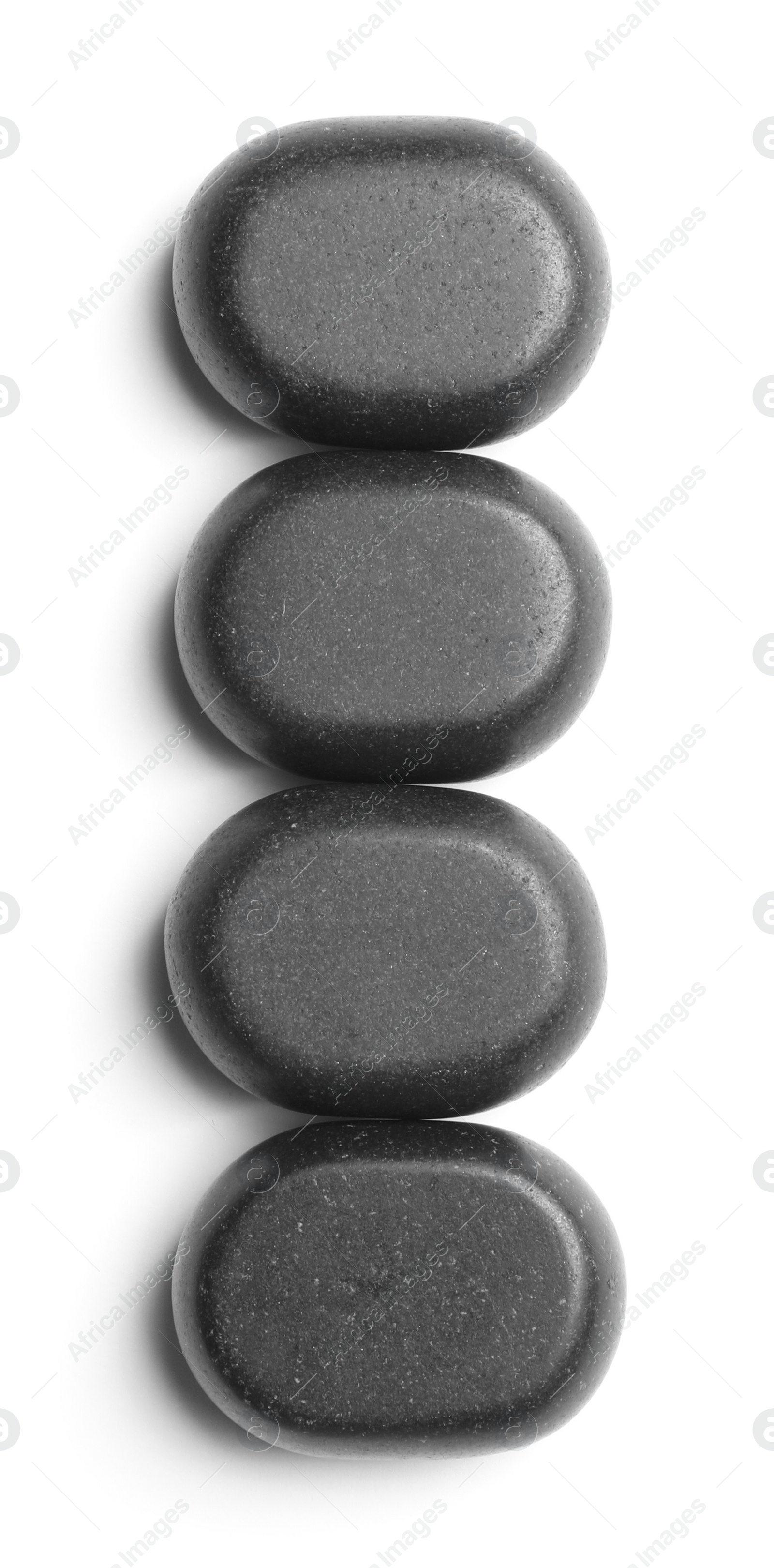 Photo of Group of black stones on white background, top view