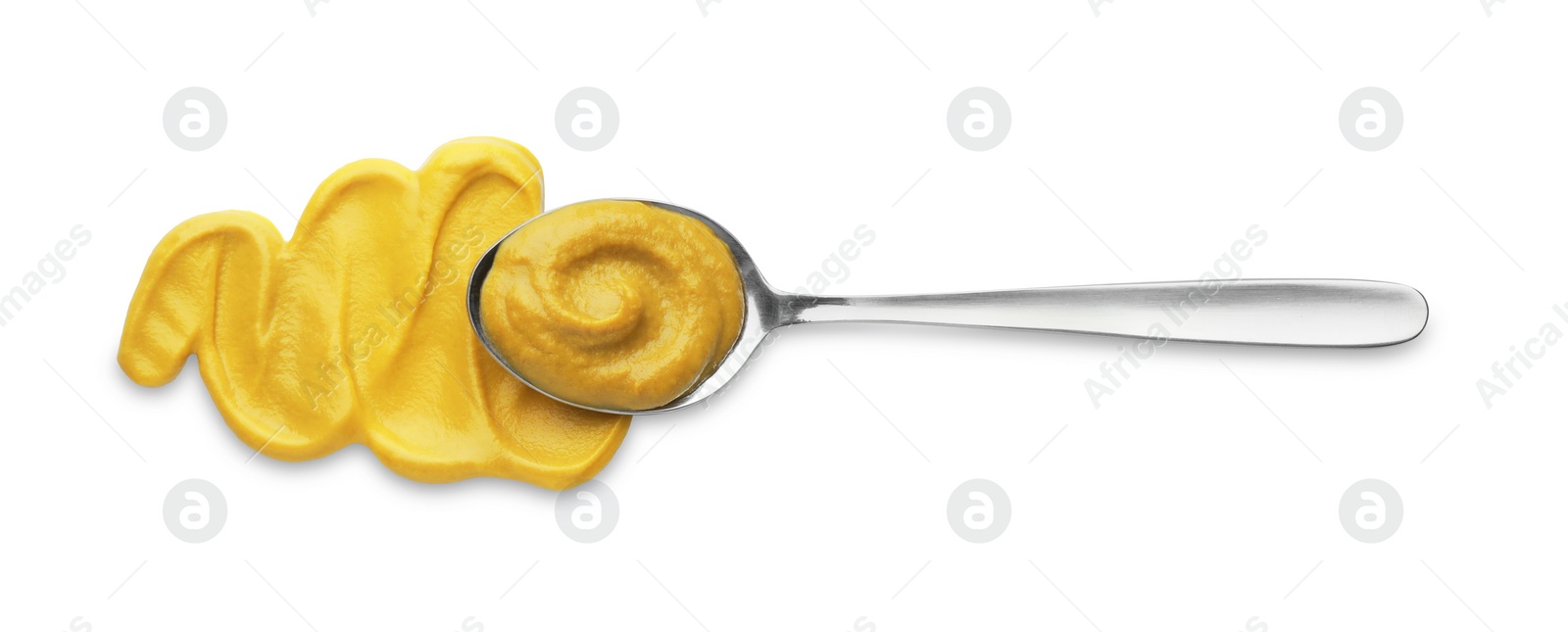 Photo of Fresh mustard sauce and spoon isolated on white, top view