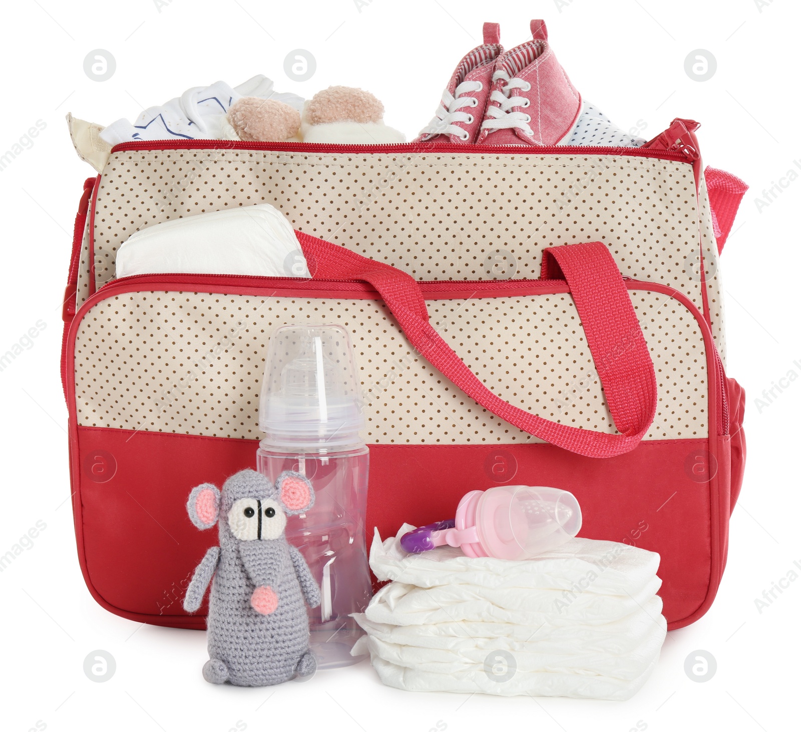 Photo of Mother's bag with baby's stuff isolated on white