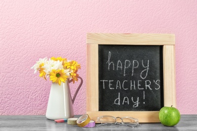 Composition with small chalkboard for Teacher's day on table