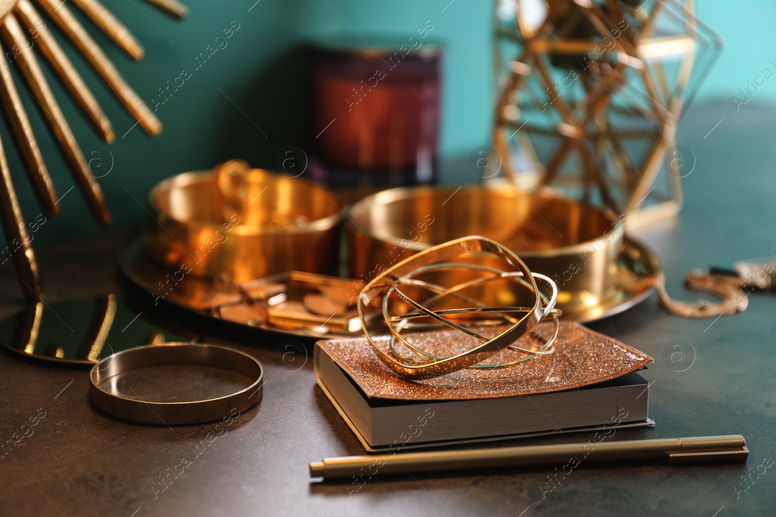 Photo of Composition with stylish accessories and interior elements on grey table