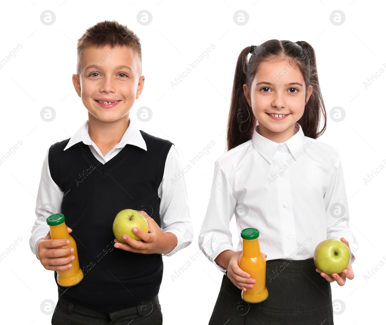 Photo of Happy children with bottles of juice and apples on white background. Healthy food for school lunch