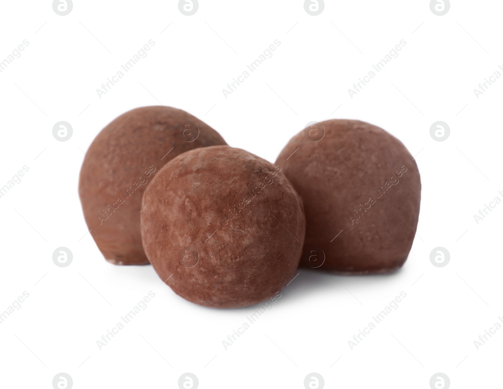 Photo of Delicious chocolate truffle candies isolated on white