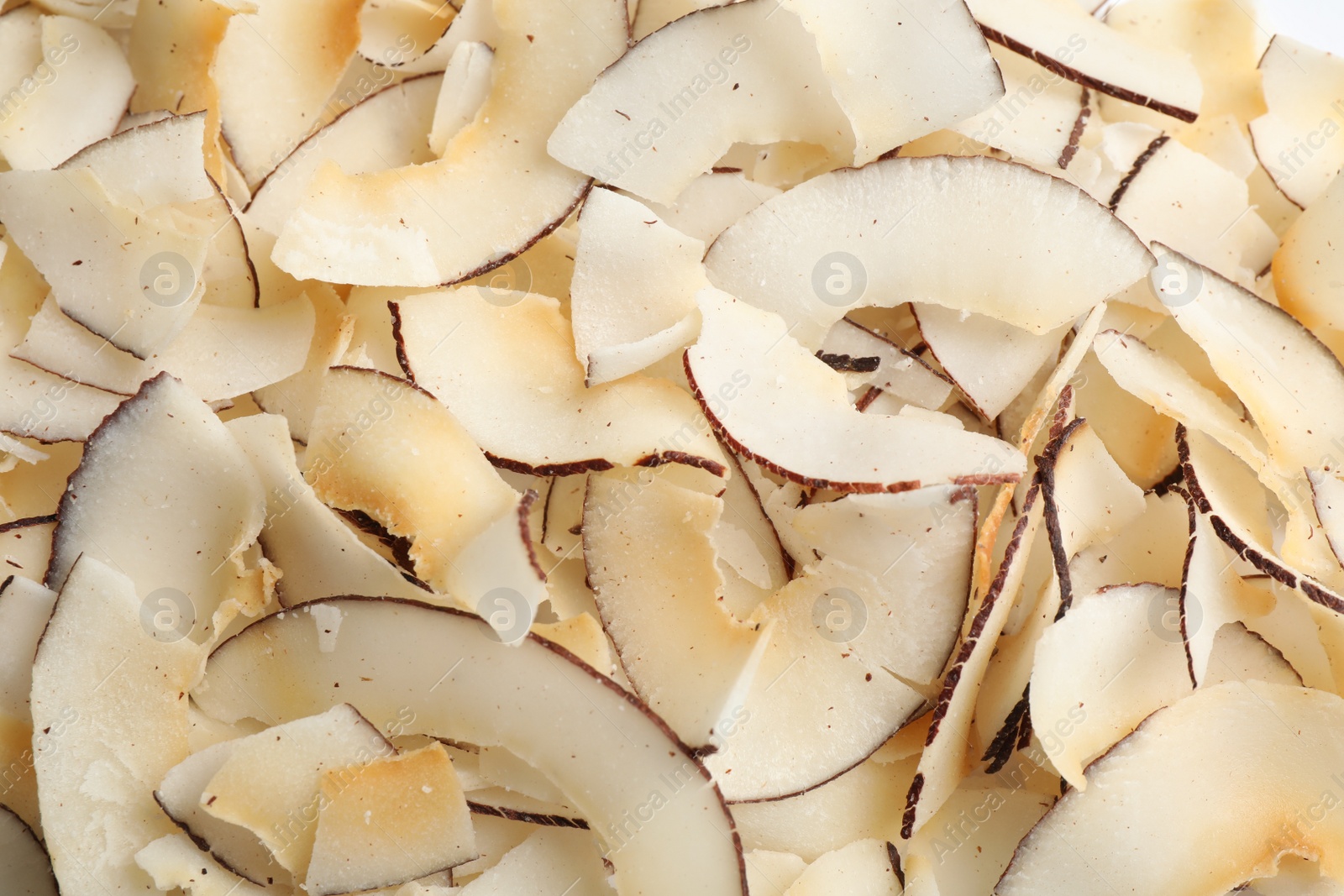 Photo of Delicious fresh coconut chips as background, closeup